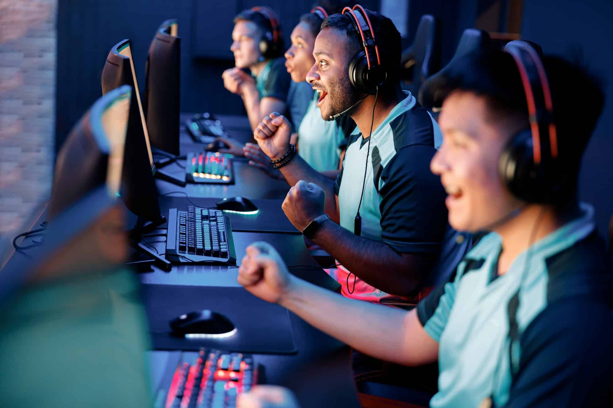 Young gamers involved in online video game at cyber club