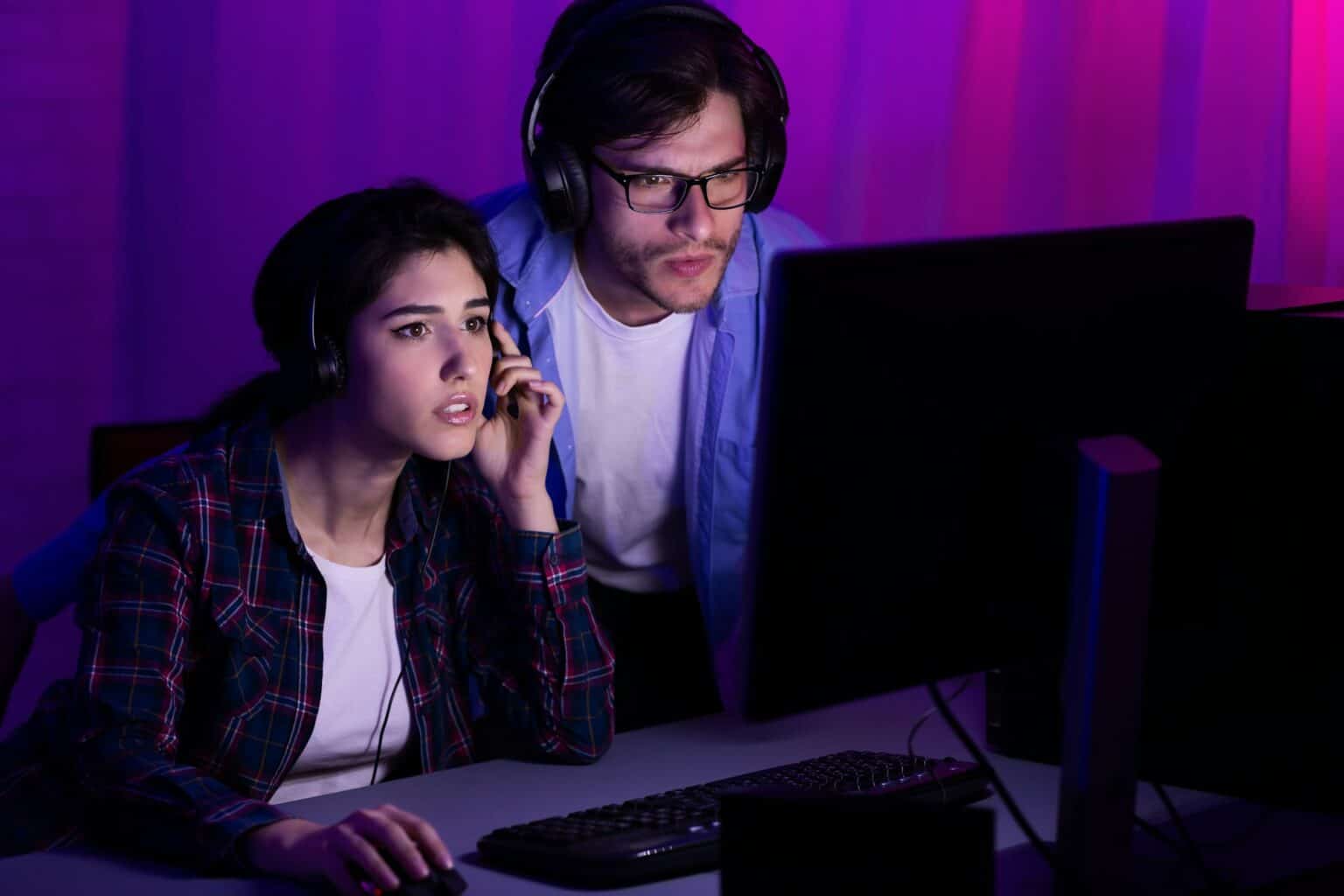 Gamers playing PC video game on eSport tournament