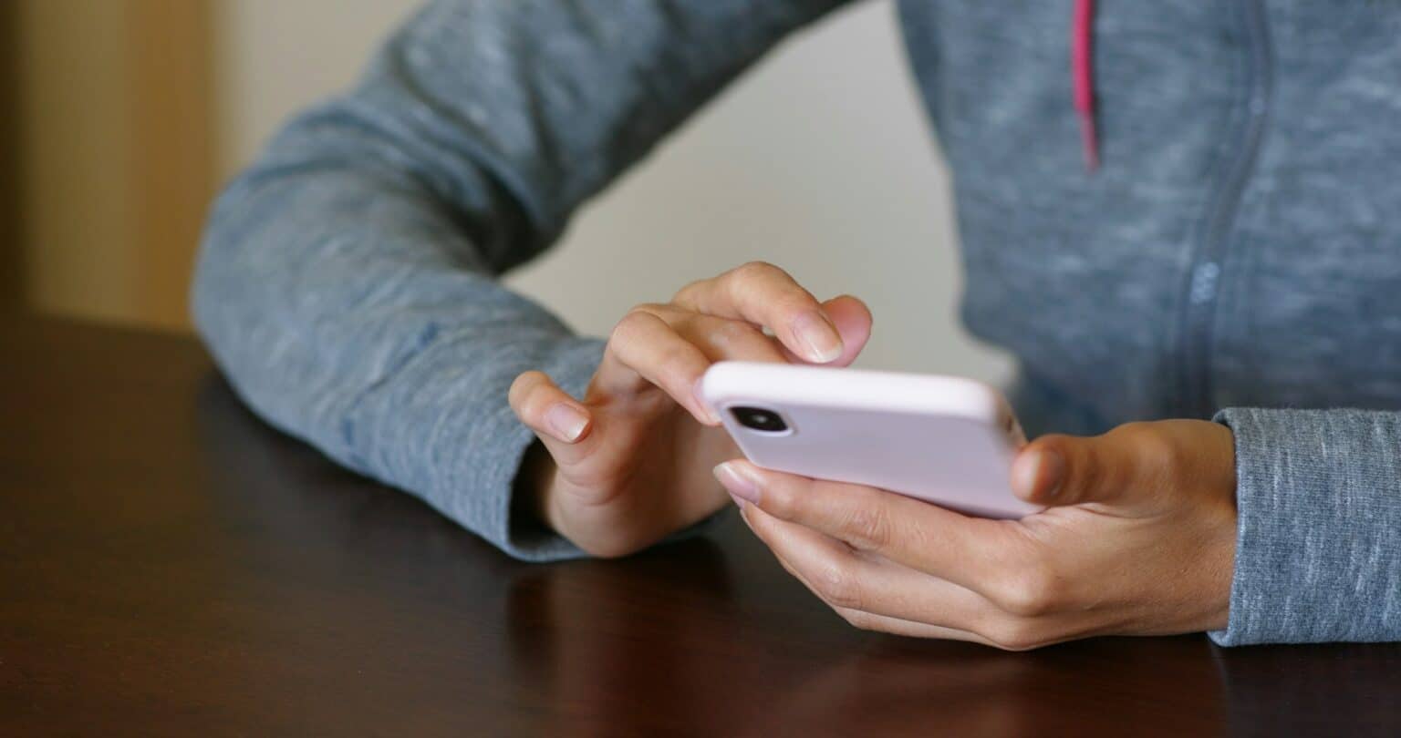 Woman use of mobile phone for online searching