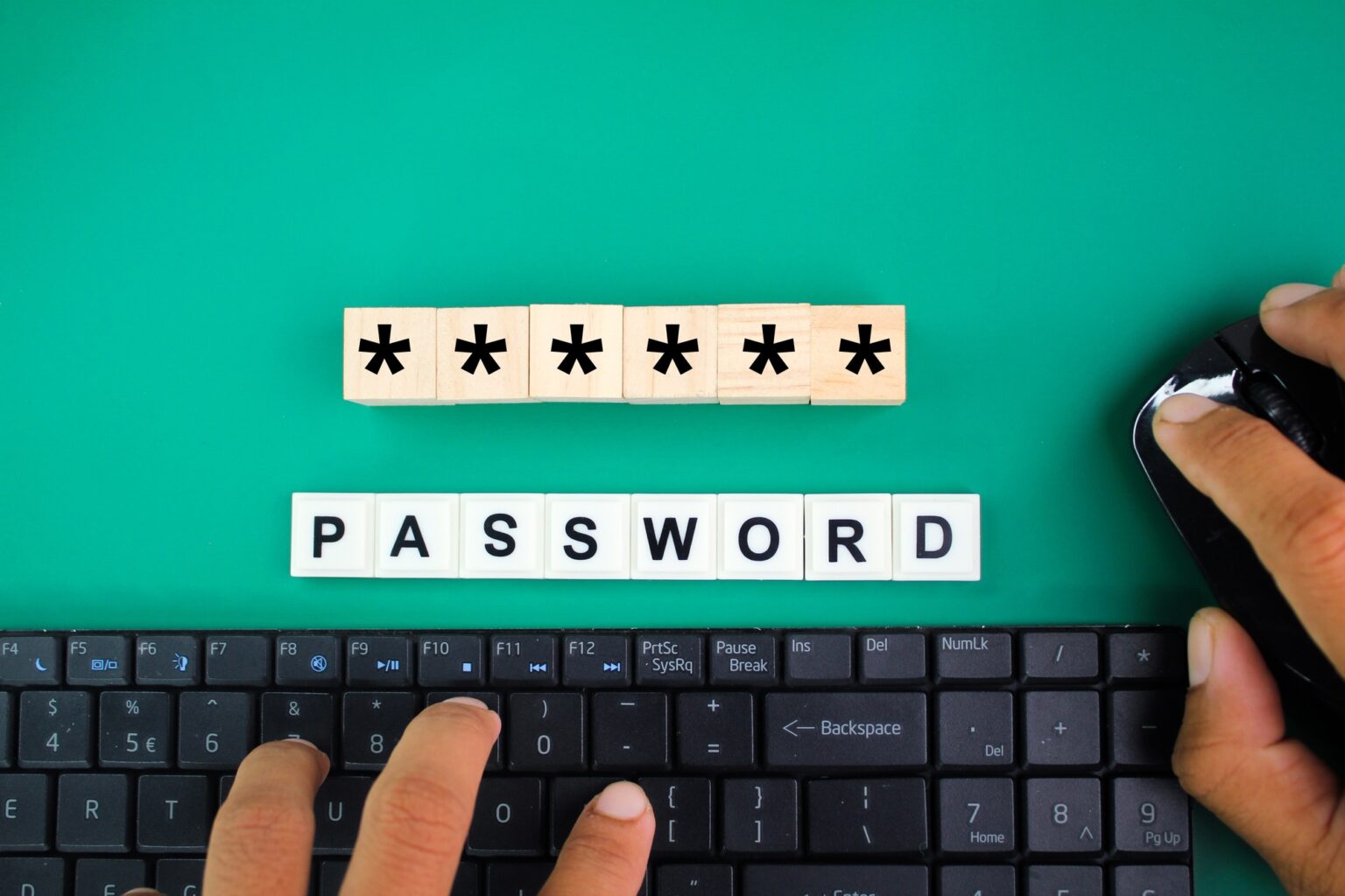 finger holding mouse and laptop keyboard with Password word and icon