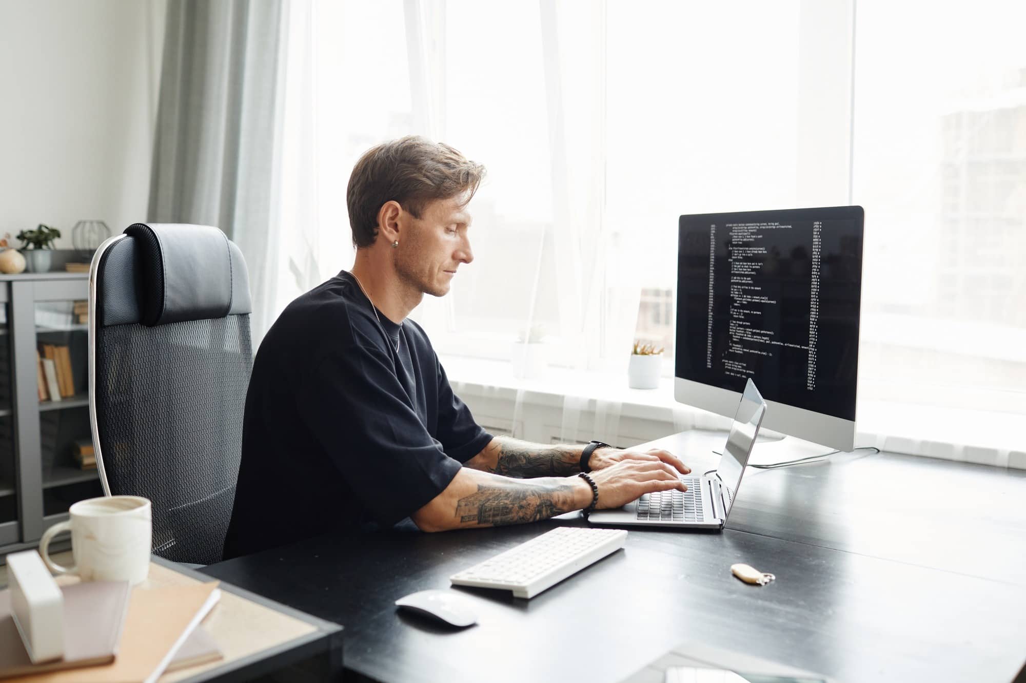 Programmer writing program code
