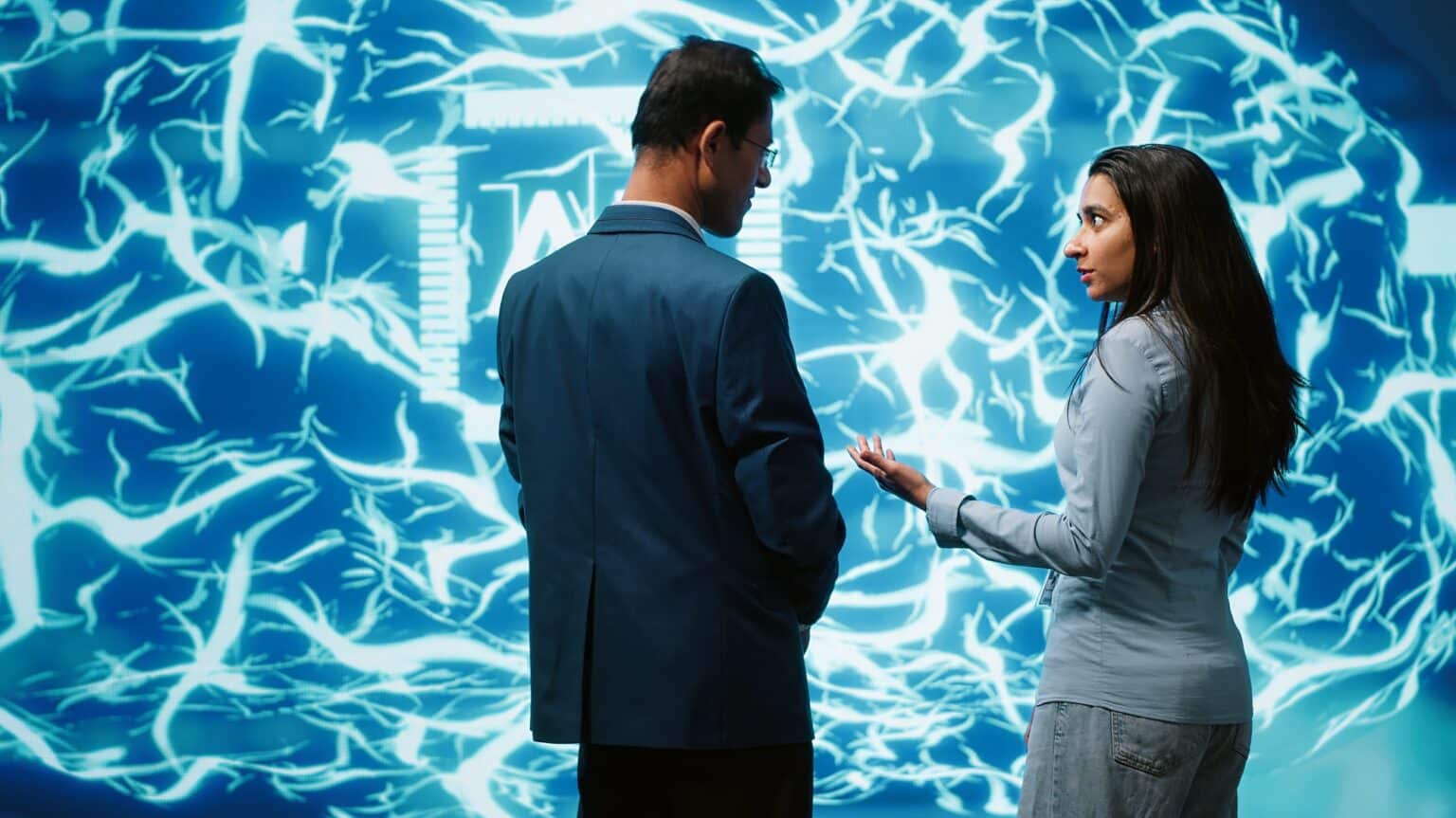 Teamworking colleagues implementing artificial intelligence