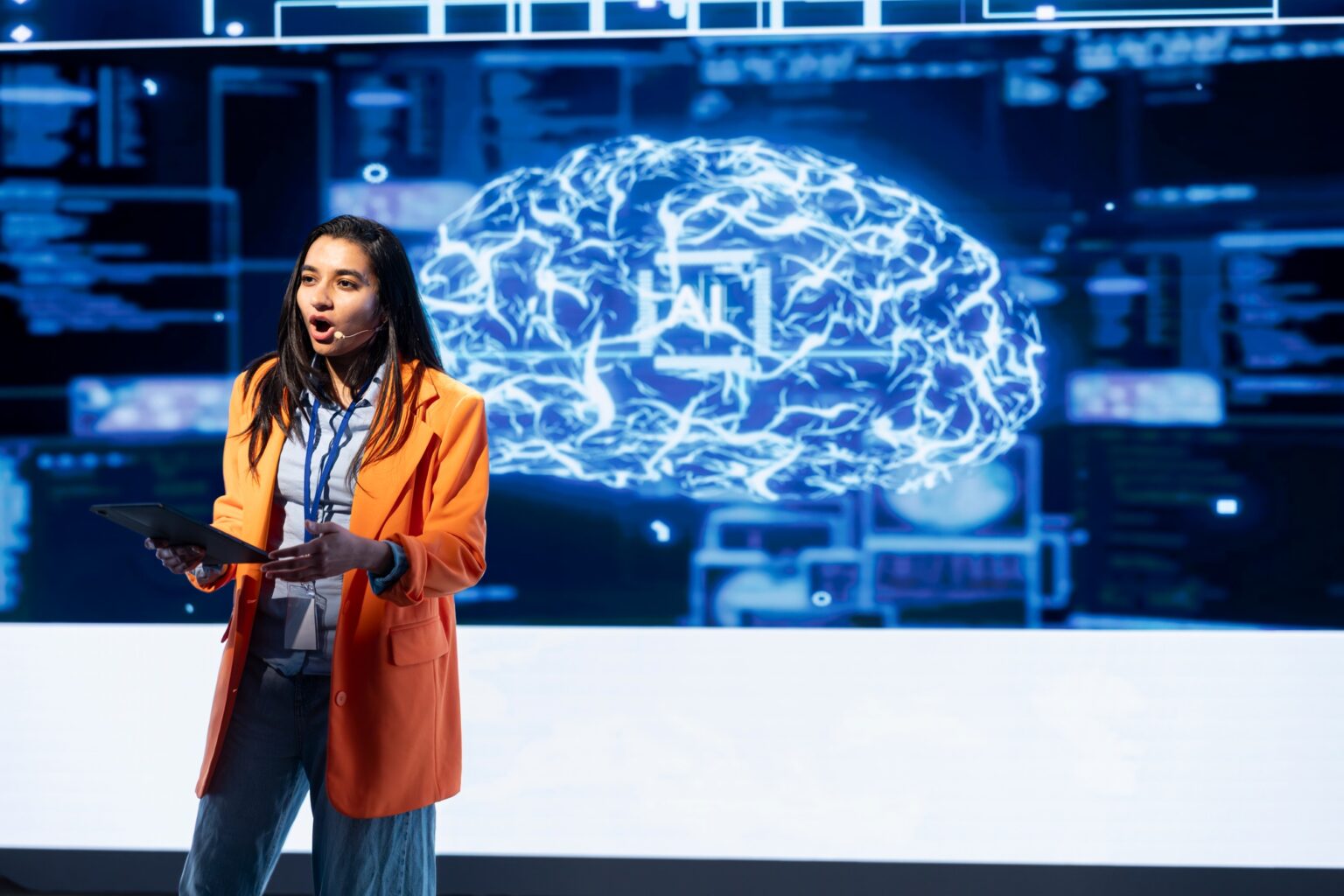 OpenAI Dévoile de Nouveaux Outils pour la Création d’Agents Intelligents Technician using tablet during AI tech presentation