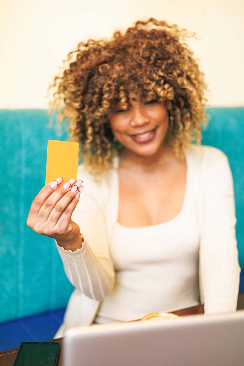 Multitasking Like a Pro: How a Dominican Woman Shops Online While Sipping Her Coffee in a Cafe