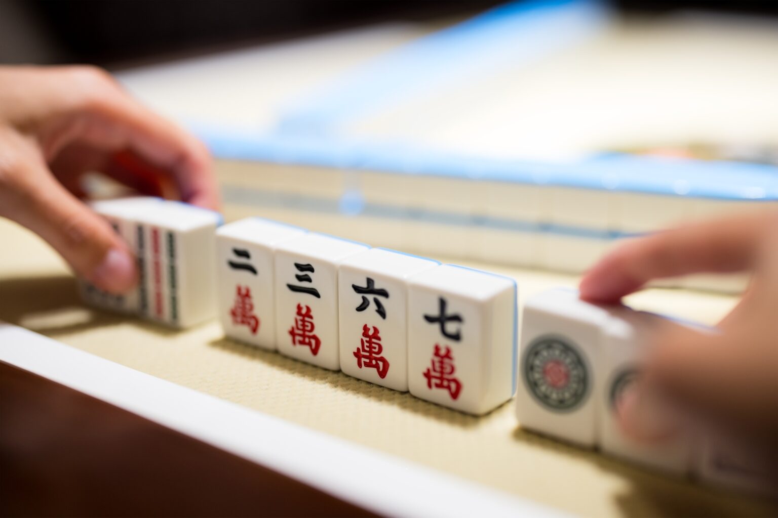 Playing Mahjong on the table